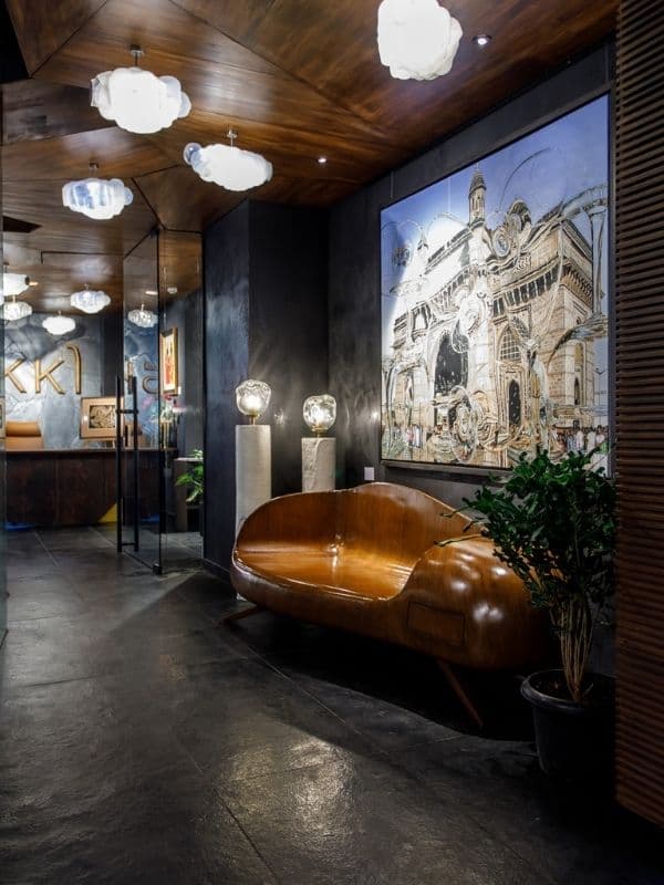 IKKO Art Gallery foyer with black surfaces and wooden accents